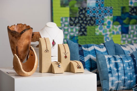 A display of hand crafted jewellery and textiles