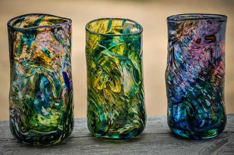 Three hand-blown, colourful glasses