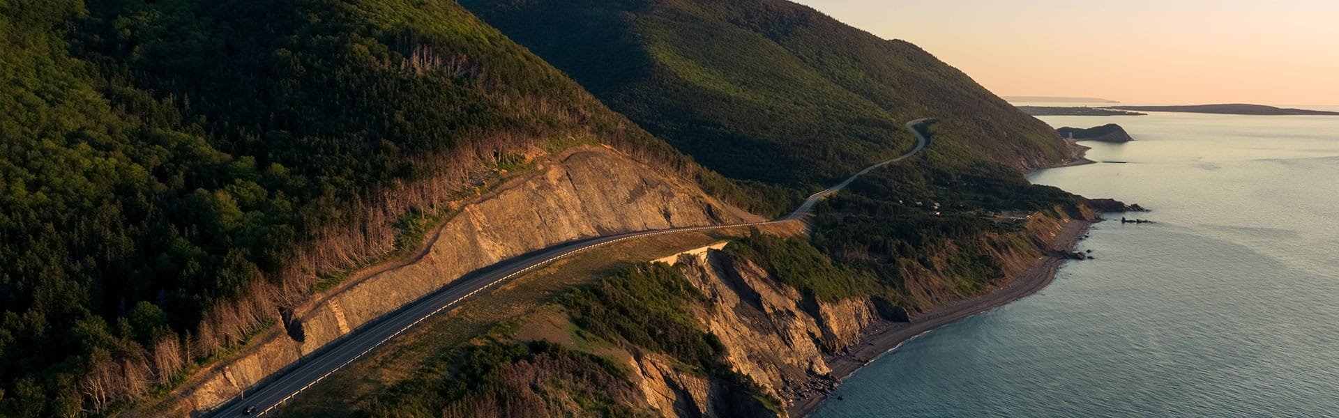 A highway winds through the coastline