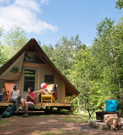 The Broad Cove Campground in Cheticamp featuring Parks Canada tents